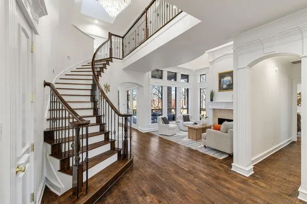 a view of entryway livingroom and hall with wooden floor