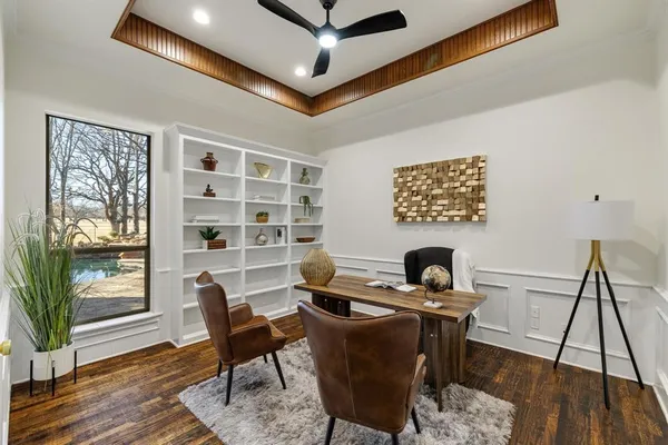 a work room with furniture and wooden floor