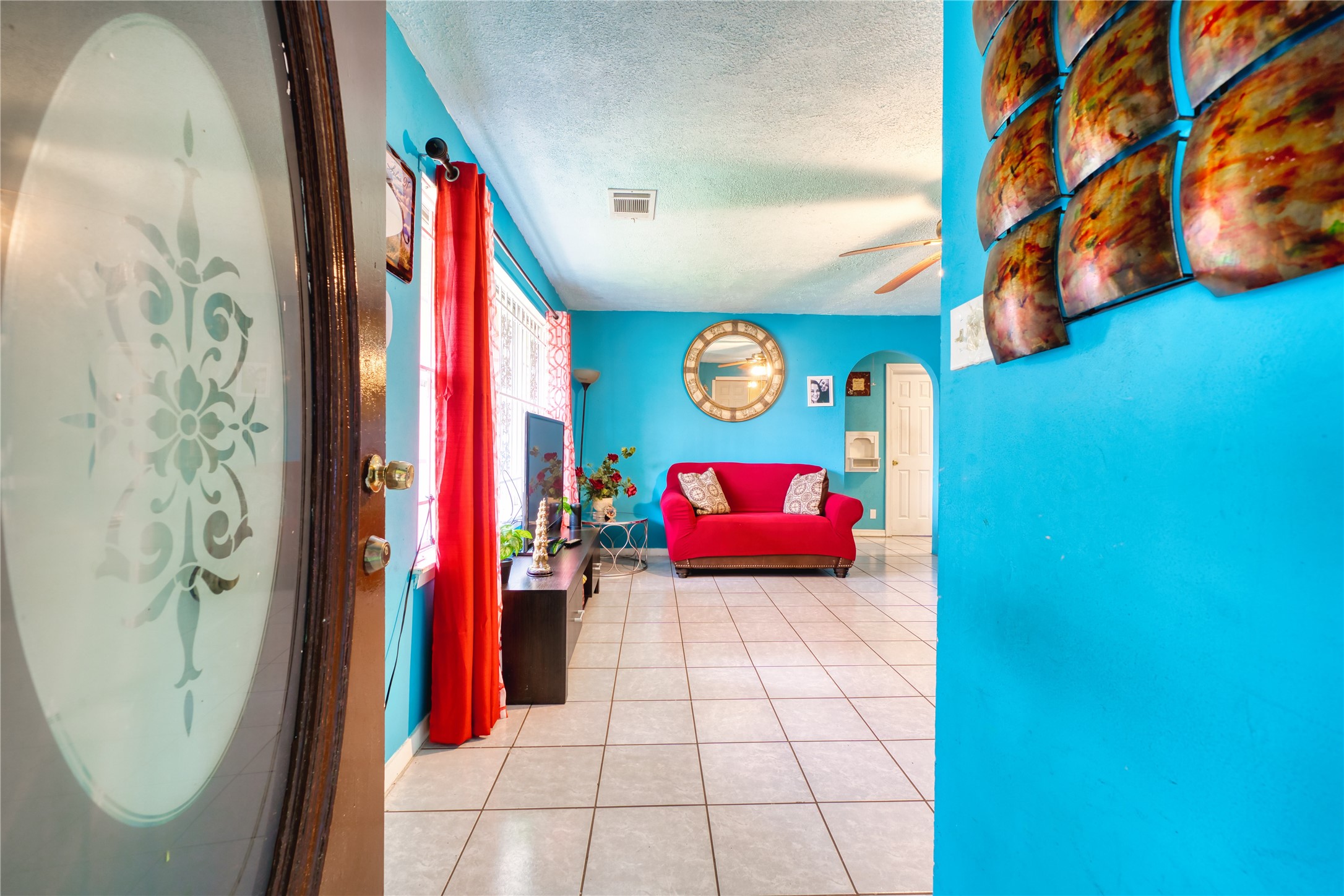 4931 Mercedes Lane Houston, TX 77022 - Photo 5 of 29 a bedroom with a bed and a painting on the wall