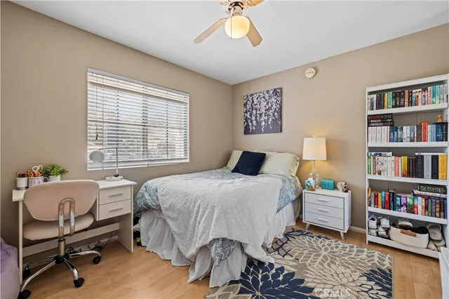 a bedroom with a bed and a book shelf