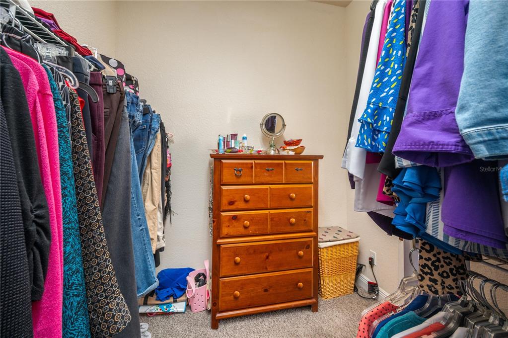35 Stembridge Road Lake Wales, FL 33898 - Photo 29 of 61 a view of walk in closet with clothes and shoes