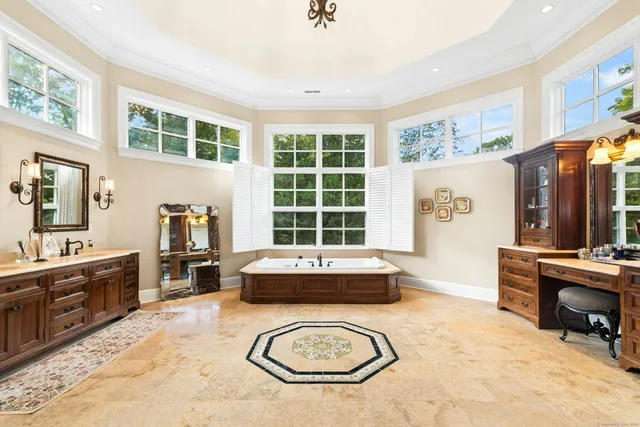 a living room with furniture a window and a flat screen tv