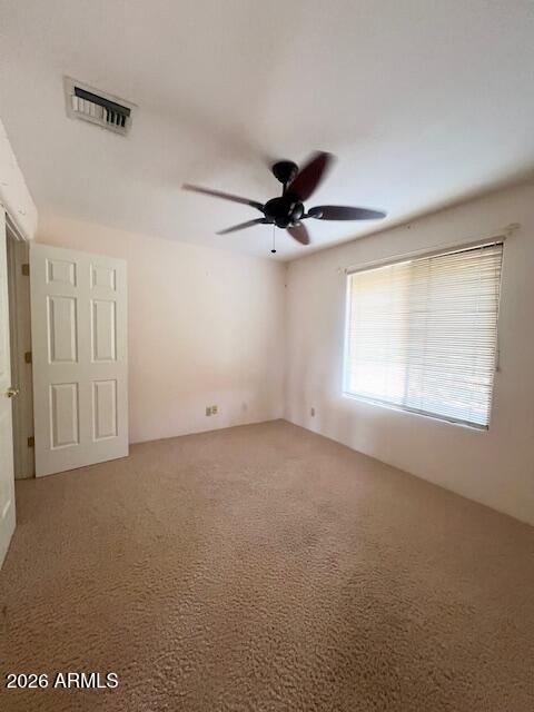 7707 East Primrose Path Carefree, AZ 85377 - Photo 13 of 42 a view of an empty room with a window