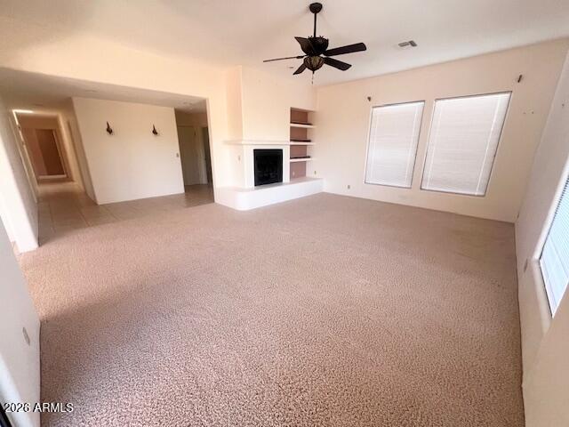 7707 East Primrose Path Carefree, AZ 85377 - Photo 15 of 42 an empty room with windows and fireplace