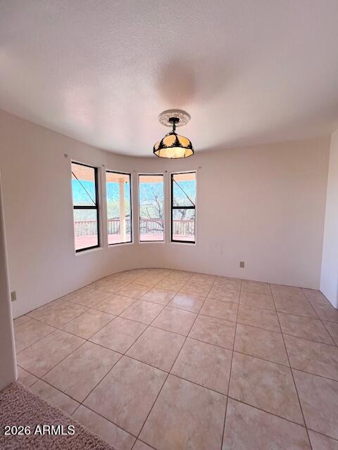 7707 East Primrose Path Carefree, AZ 85377 - Photo 18 of 42 a view of an empty room with a window