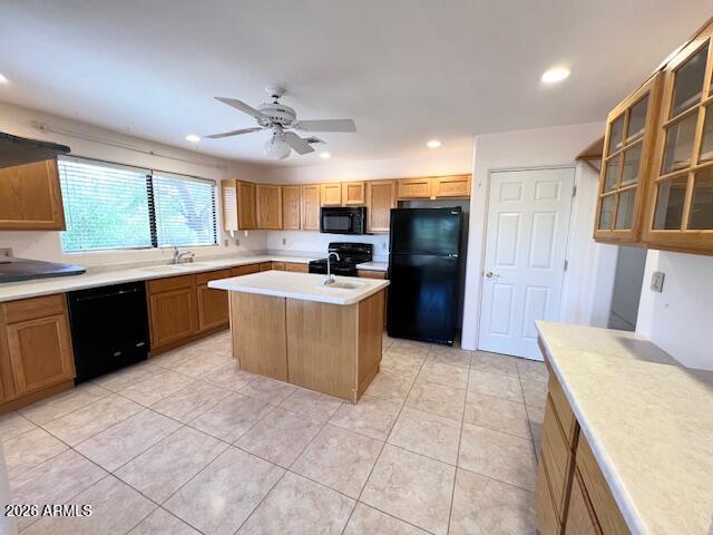 7707 East Primrose Path Carefree, AZ 85377 - Photo 19 of 42 a kitchen with a sink a counter top space cabinets and stainless steel appliances
