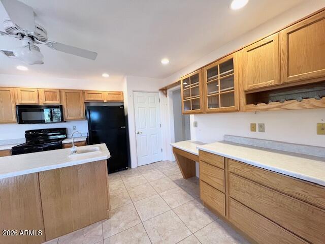 7707 East Primrose Path Carefree, AZ 85377 - Photo 21 of 42 a kitchen with stainless steel appliances wooden cabinets and a sink