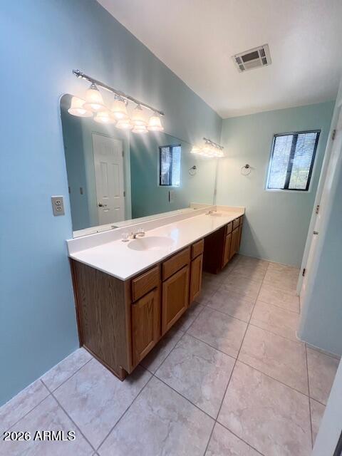 7707 East Primrose Path Carefree, AZ 85377 - Photo 5 of 42 a room with a sink vanity and mirror