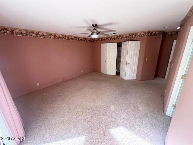 7707 East Primrose Path Carefree, AZ 85377 - Photo 7 of 42 a view of a livingroom with a ceiling fan and window