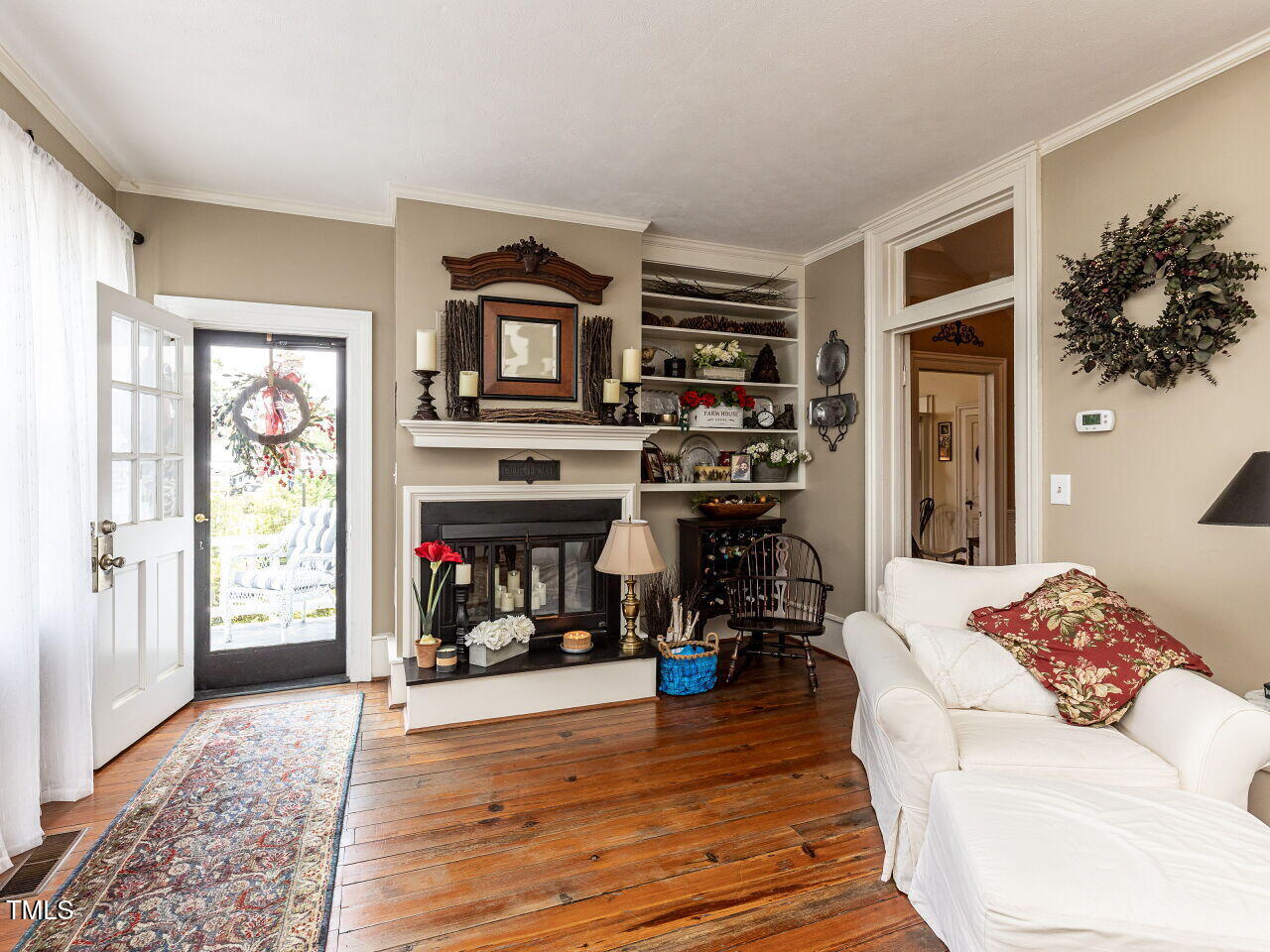 612 College Street Clinton, NC 28328 - Photo 10 of 70 a living room with furniture and a fireplace