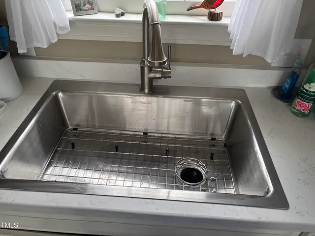 a view of a chairs and table on the wooden deck