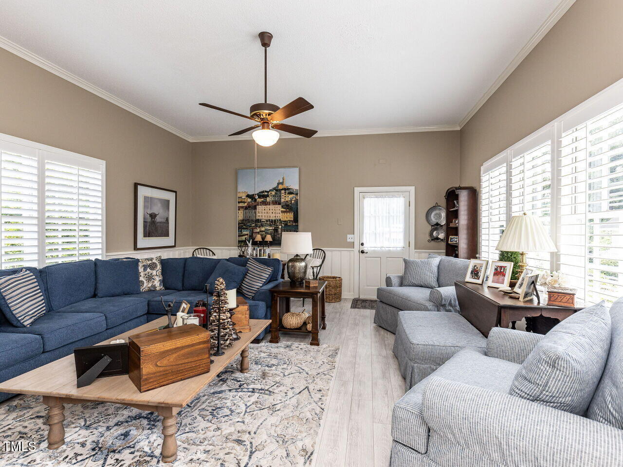 612 College Street Clinton, NC 28328 - Photo 19 of 70 a living room with furniture ceiling fan and a window