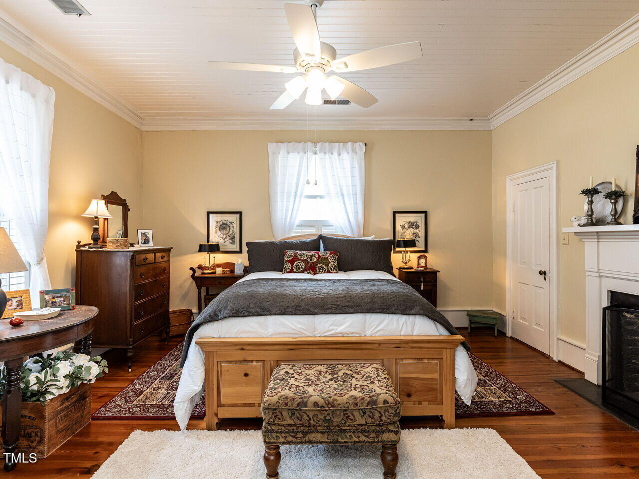 612 College Street Clinton, NC 28328 - Photo 24 of 70 a bedroom with a bed and wooden floor
