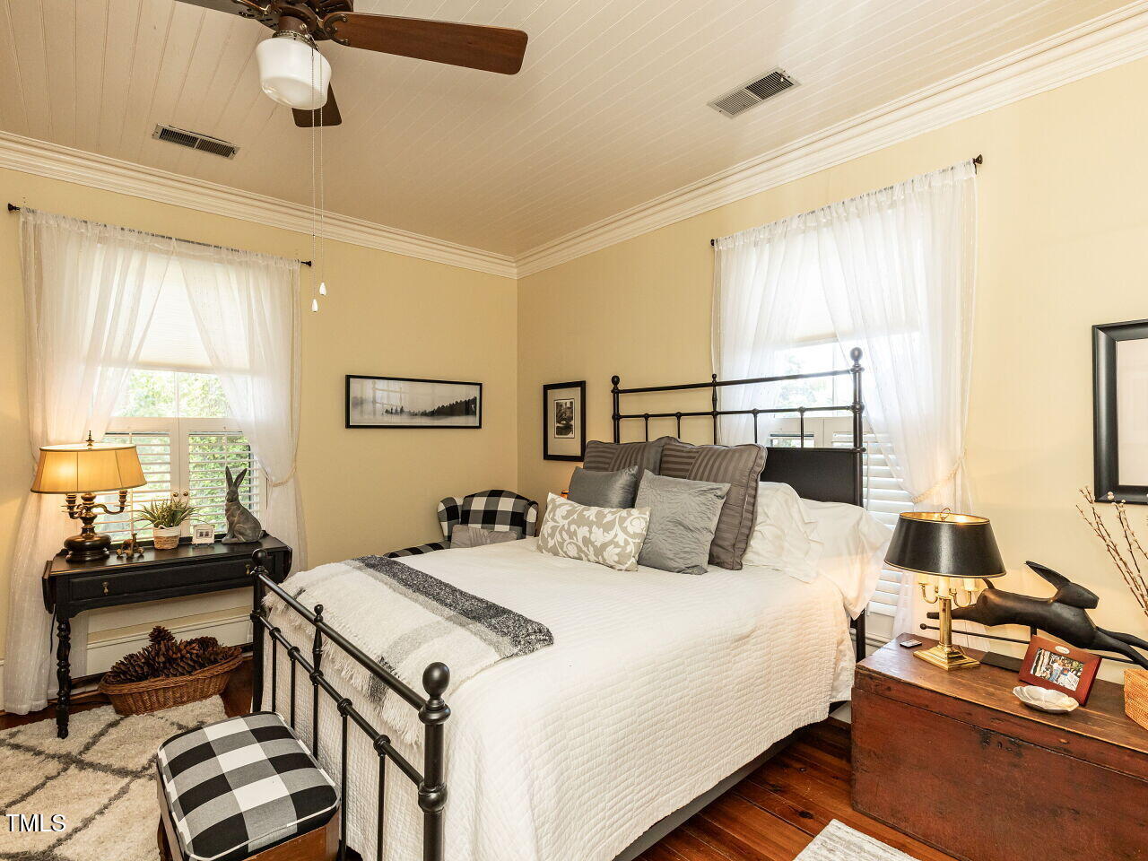 612 College Street Clinton, NC 28328 - Photo 28 of 70 a bedroom with a bed and a chandelier