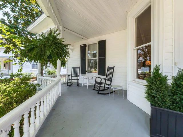 a view of a livingroom with furniture and hardwood floor