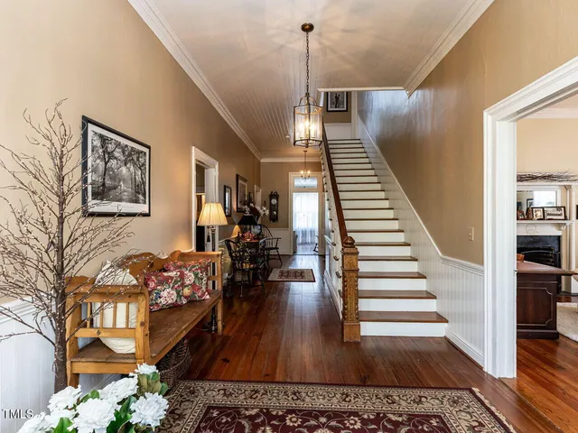 a kitchen with stainless steel appliances kitchen island granite countertop a refrigerator and a stove top oven