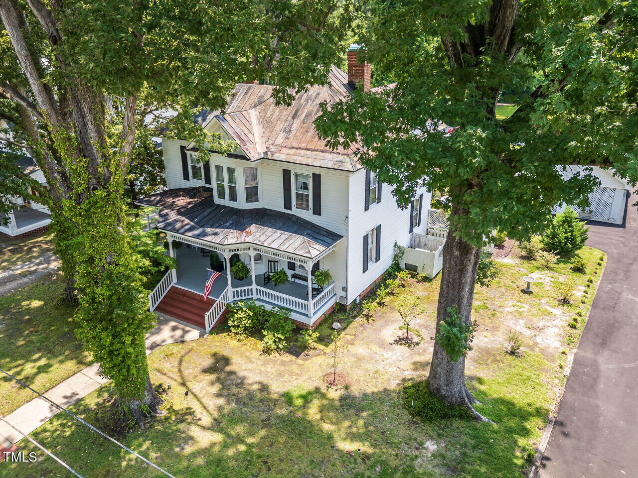 612 College Street Clinton, NC 28328 - Photo 55 of 70 a view of house with backyard space and balcony