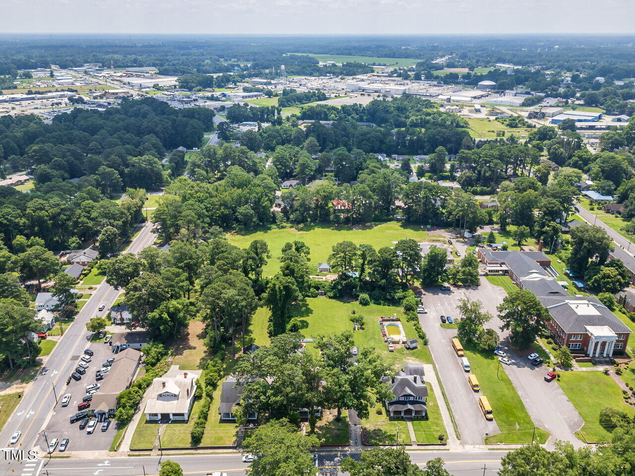 612 College Street Clinton, NC 28328 - Photo 57 of 70 an aerial view of residential houses with outdoor space and trees