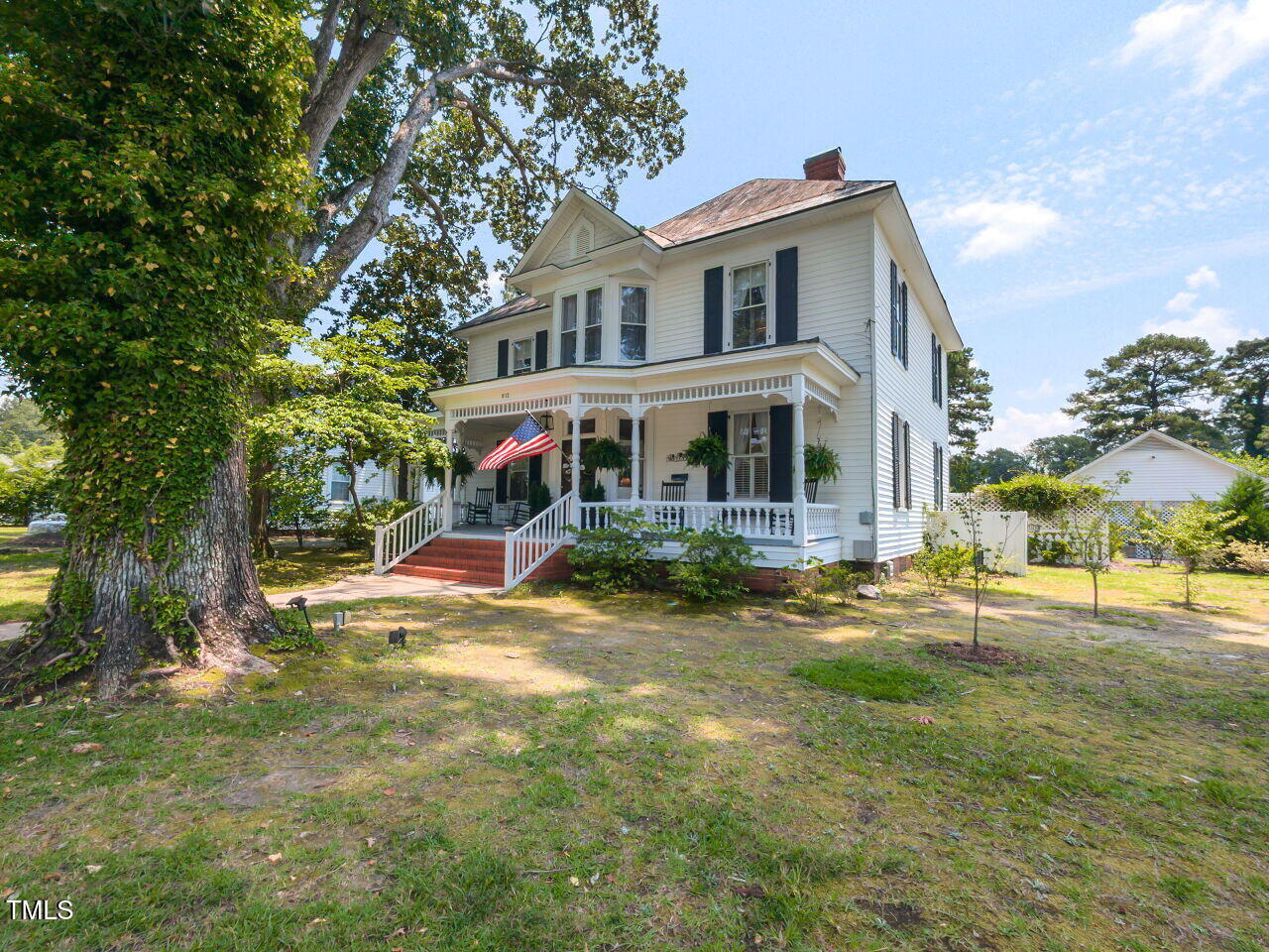 612 College Street Clinton, NC 28328 - Photo 61 of 70 a view of a house with a yard