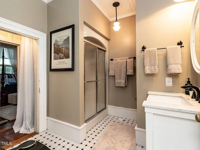 a living room with furniture a flat screen tv and a large window