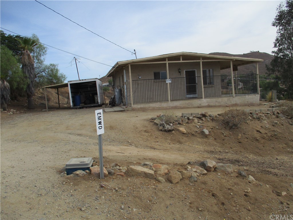 28385 Goetz Road Menifee, CA 92587 - Photo 1 of 1 a front view of a house with a garden
