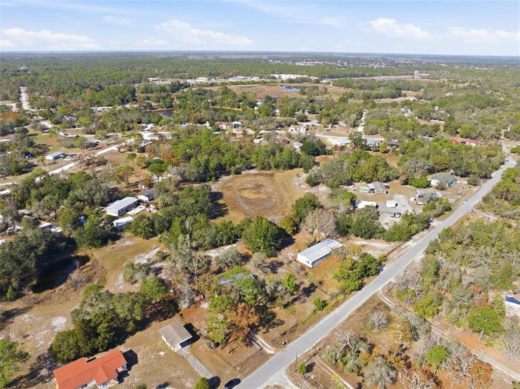 8045 Indian Trail Road Weeki Wachee, FL 34613 - Photo 46 of 49 an aerial view of residential houses with outdoor space
