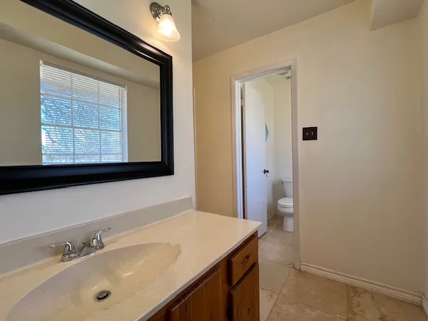 a bathroom with a sink a vanity and a mirror