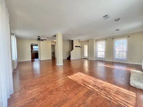 a view of a living room kitchen and a stove