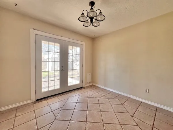 a view of an empty room and window