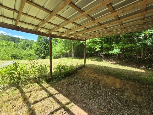 a backyard of a house with lots of green space