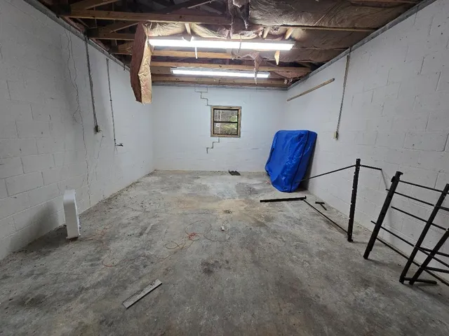 a view of entryway with furniture and wooden floor