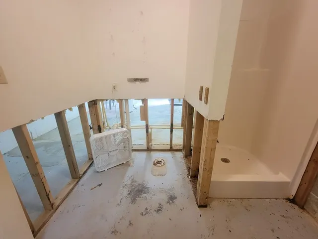 a view of an empty room with stairs