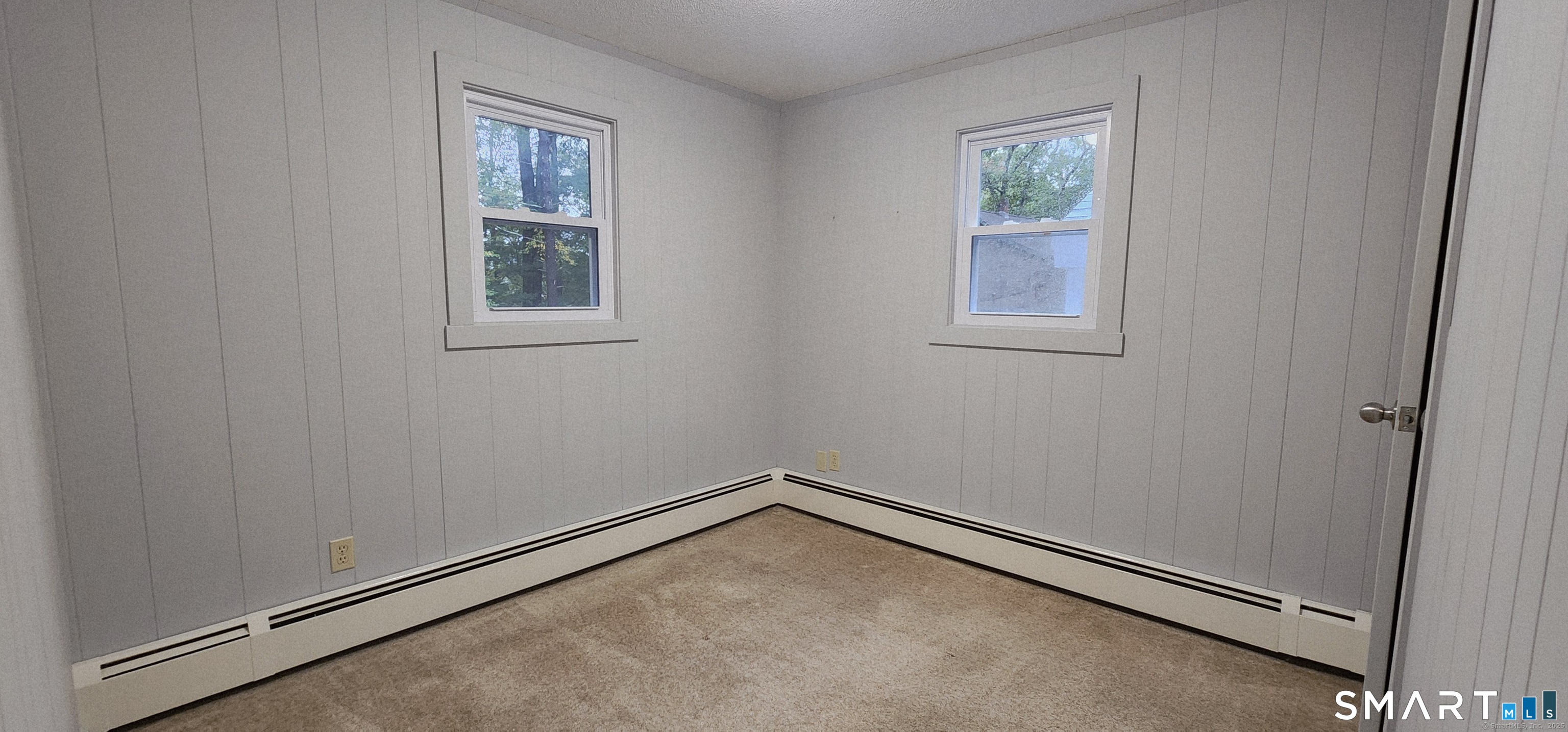 1267-unit B Thompson Road Thompson, CT 06277 - Photo 3 of 7 an empty room with windows