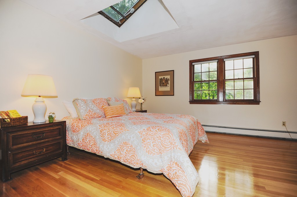 16 Olde Lantern Road Acton, MA 01720 - Photo 11 of 16 a bedroom with a bed and a night stand
