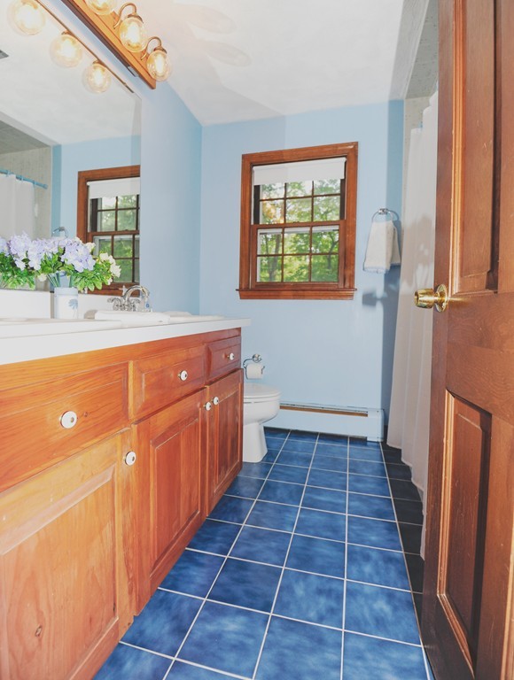16 Olde Lantern Road Acton, MA 01720 - Photo 12 of 16 a bathroom with sink toilet and shower