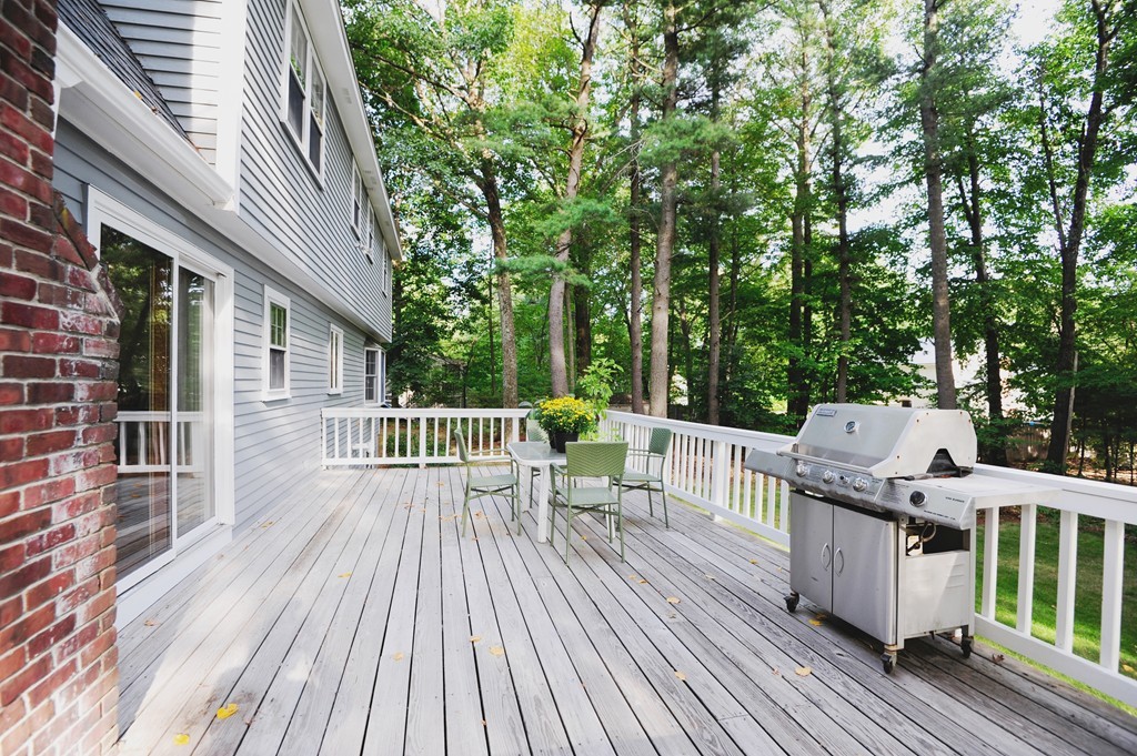 16 Olde Lantern Road Acton, MA 01720 - Photo 15 of 16 a view of a deck with couches wooden fence and floor