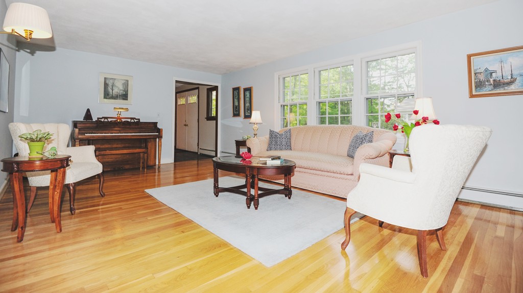 16 Olde Lantern Road Acton, MA 01720 - Photo 3 of 16 a living room with furniture a table and a large window