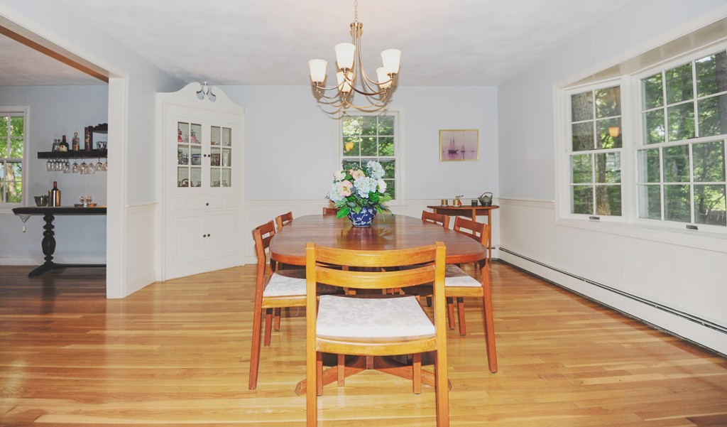 16 Olde Lantern Road Acton, MA 01720 - Photo 4 of 16 a dining room with chandelier and wooden floor