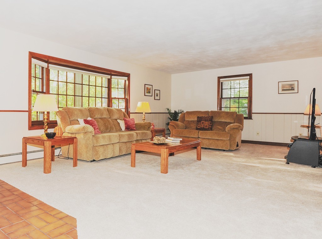 16 Olde Lantern Road Acton, MA 01720 - Photo 9 of 16 a living room with furniture and a window