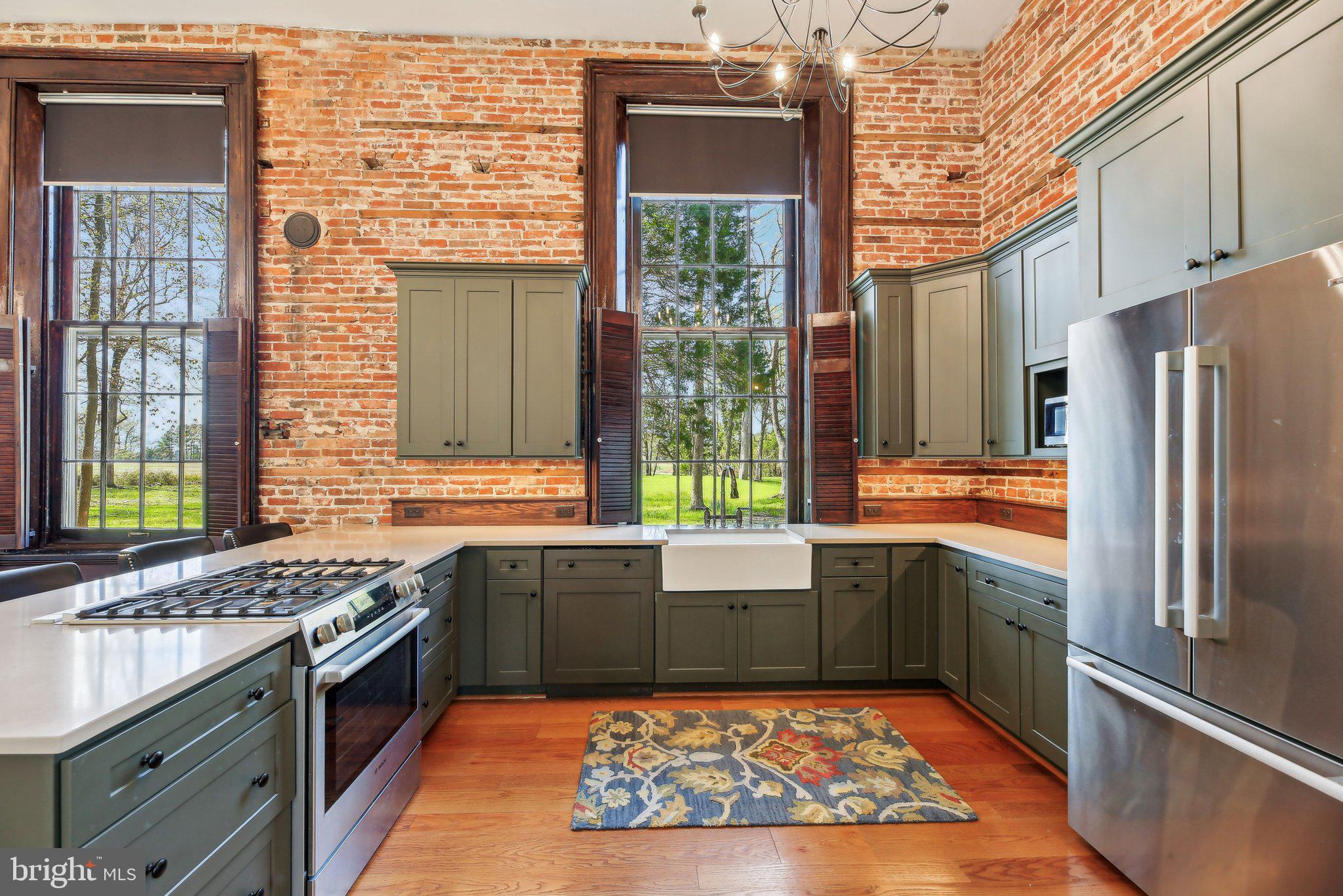 5179 Quaker Neck Road Chestertown, MD 21620 - Photo 11 of 48 a kitchen with stainless steel appliances granite countertop a sink stove and refrigerator