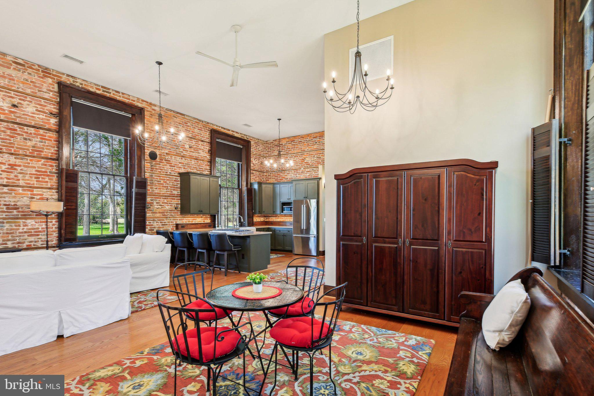 5179 Quaker Neck Road Chestertown, MD 21620 - Photo 18 of 48 a view of a dining room with furniture a chandelier and wooden floor