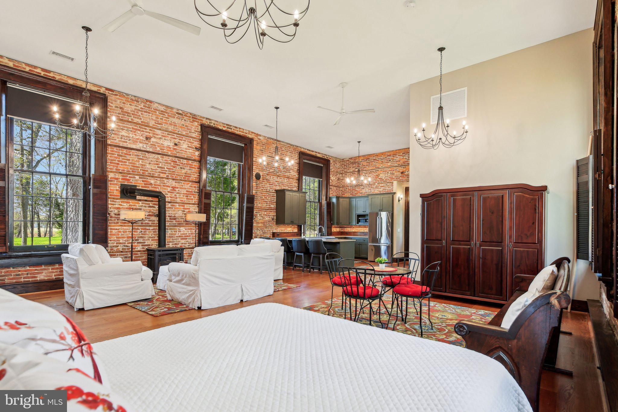5179 Quaker Neck Road Chestertown, MD 21620 - Photo 21 of 48 a bedroom with furniture and a large window