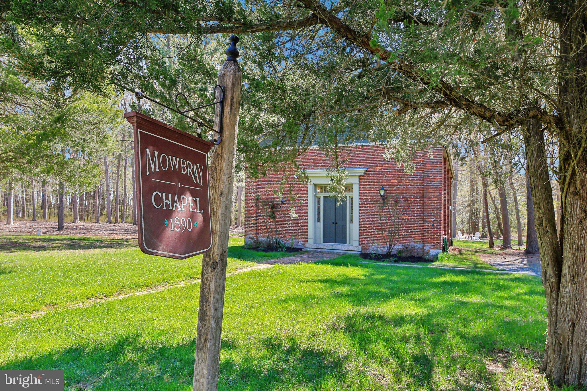 5179 Quaker Neck Road Chestertown, MD 21620 - Photo 3 of 48 a sign on the side of the house
