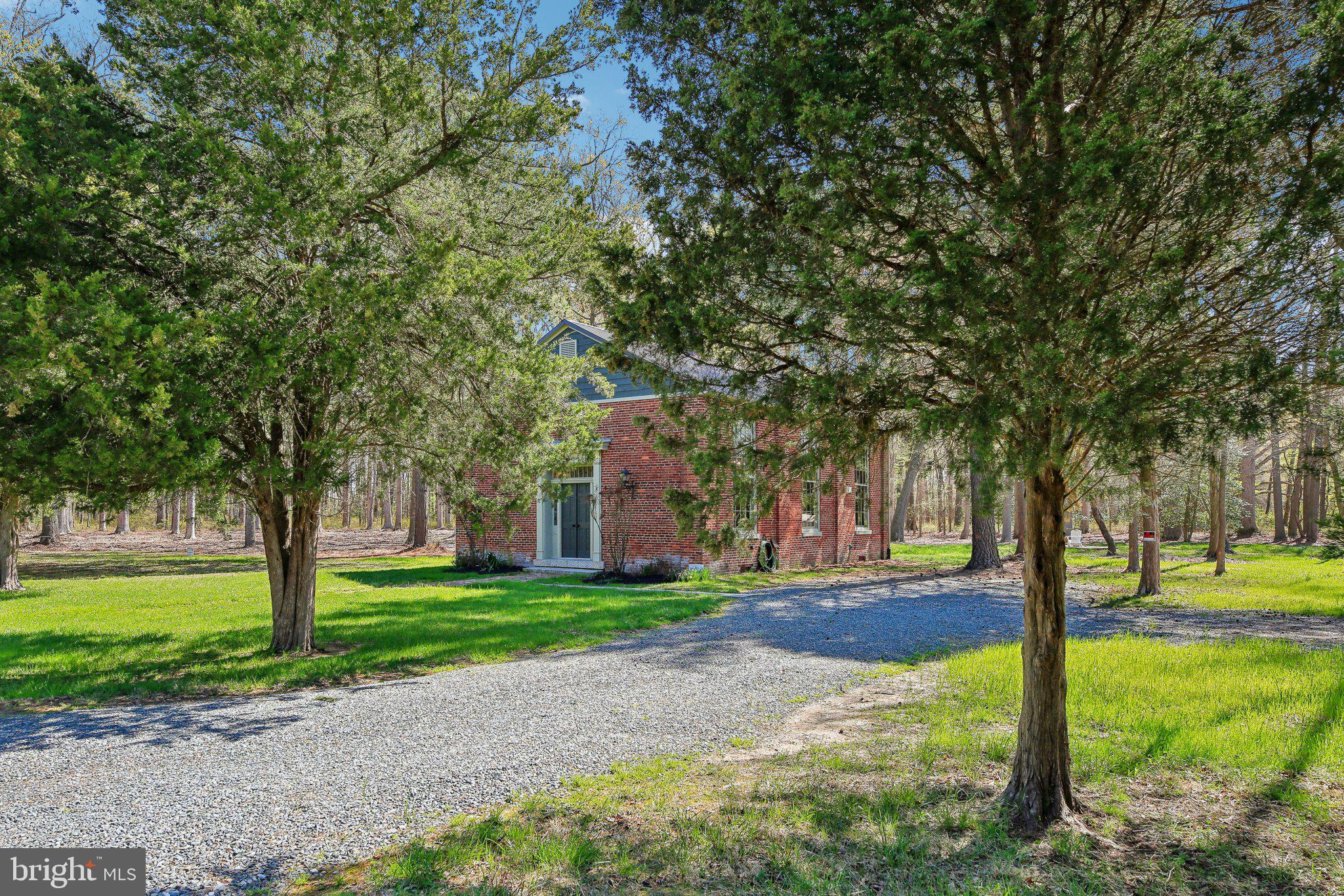 5179 Quaker Neck Road Chestertown, MD 21620 - Photo 4 of 48 a front view of a building with trees