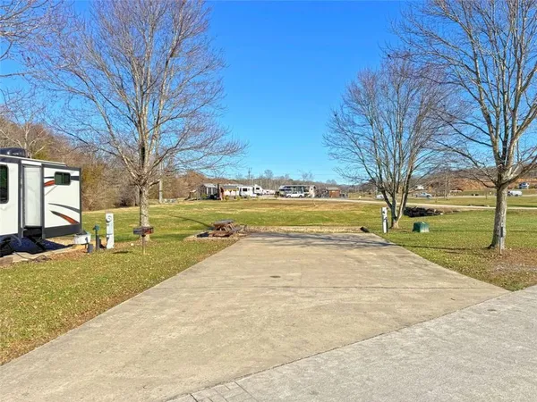a view of a yard with swimming pool