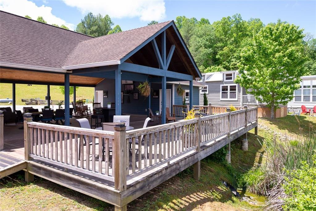 33 Mountain Meadows Circle Morganton, GA 30560 - Photo 20 of 35 a view of a house with wooden deck and a floor to ceiling window