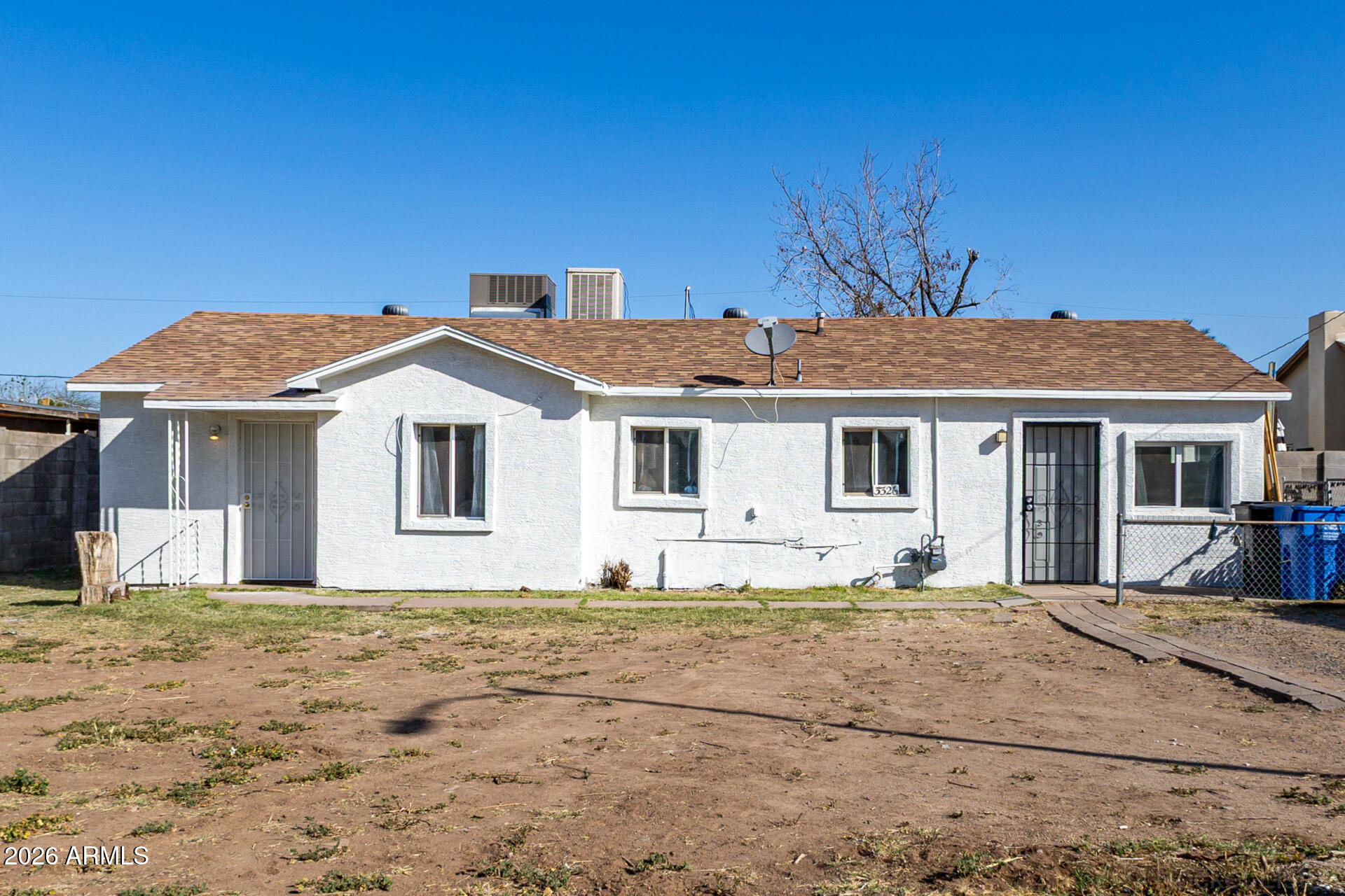 3326 West Culver Street Phoenix, AZ 85009 - Photo 1 of 18 a front view of a house with a yard
