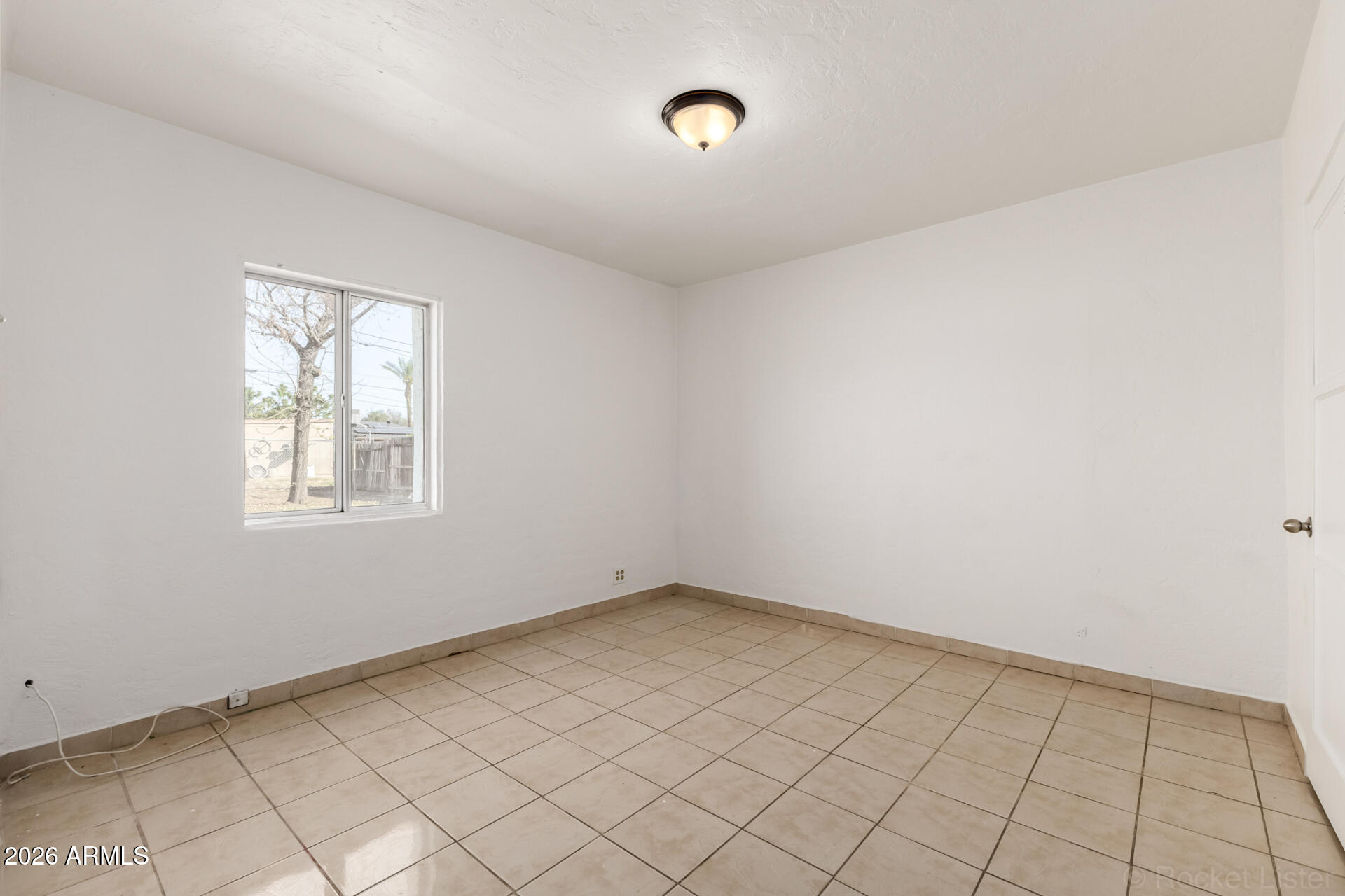3326 West Culver Street Phoenix, AZ 85009 - Photo 12 of 18 an empty room with windows