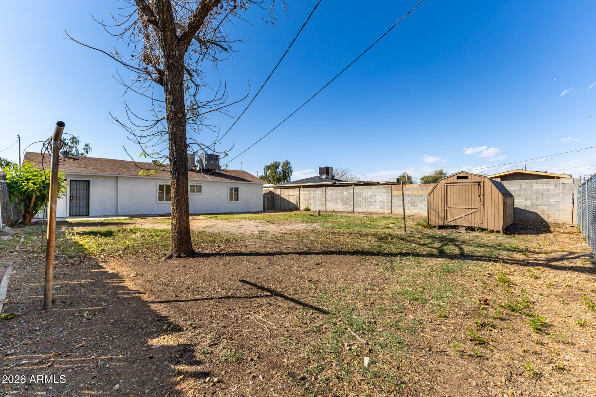 3326 West Culver Street Phoenix, AZ 85009 - Photo 17 of 18 a view of a house with a yard