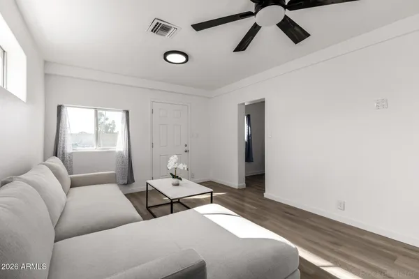 a living room with furniture and window